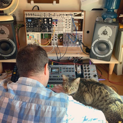 Matt Norton playing in our office + our cat